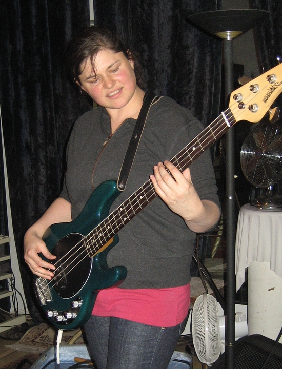 Andrea Brockie - Bass guitar